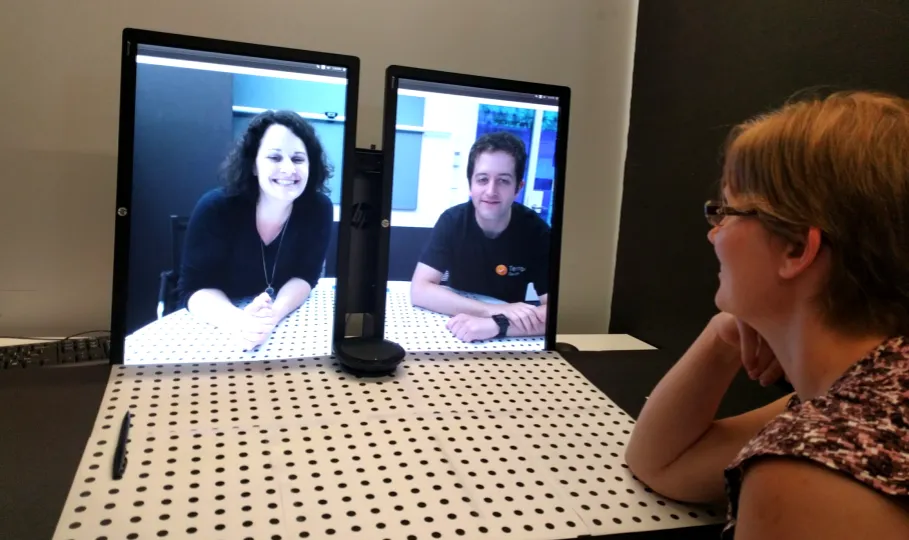 A research prototype: a meeting room rigged with dSLR cameras strapped to the walls.
